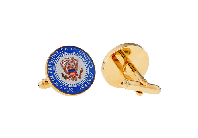 Gold cufflinks with the President of the United States seal on a white background