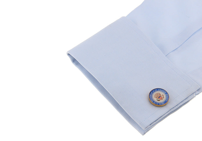 Light blue pocket square with a round emblem on a white background