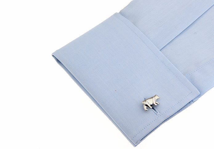 Light blue pocket square with a white bear-shaped cufflink on a white background