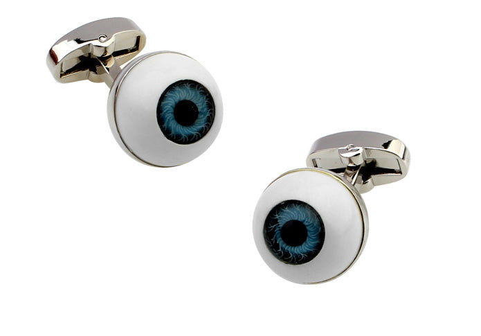 Cufflinks designed like eyeballs with white sclera and blue irises on a white background