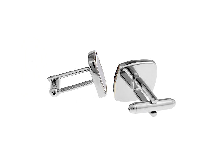 Pair of silver cufflinks on a white background