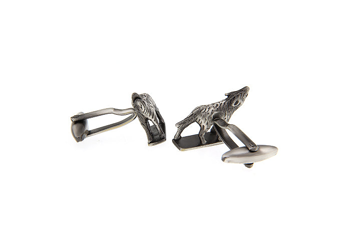 Wolf-shaped cufflinks on a white background