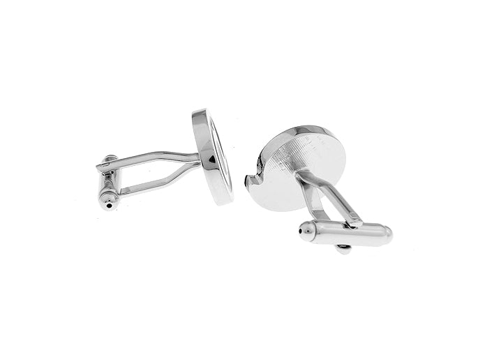 Silver cufflinks on a white background