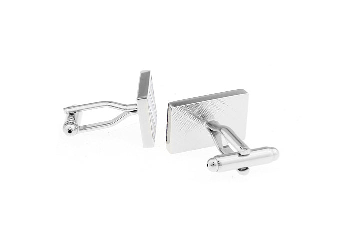 Pair of silver square cufflinks on a white background