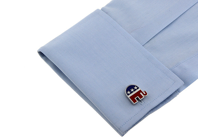 Cufflink with a logo on a light blue shirt cuff