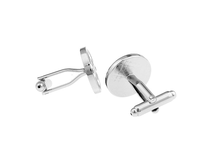 Silver cufflinks on a white background