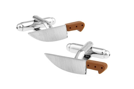 Cufflinks designed like chef's knives with brown handles on a white background