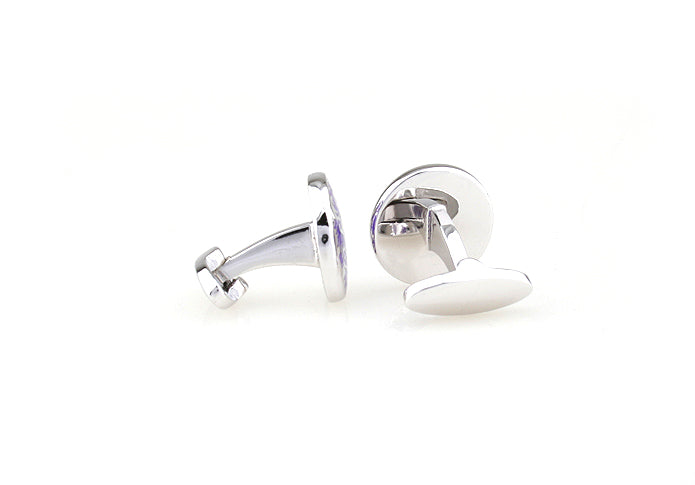 Silver cufflinks on a white background