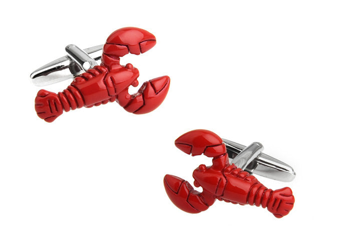 Red lobster-shaped cufflinks on a white background