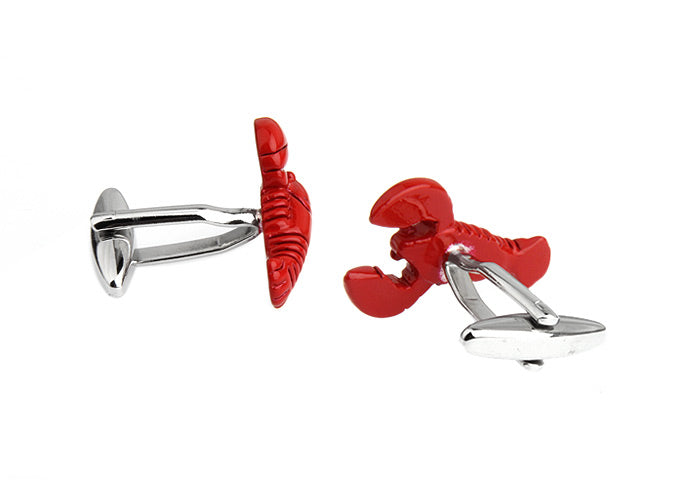 Red lobster-shaped cufflinks on a white background