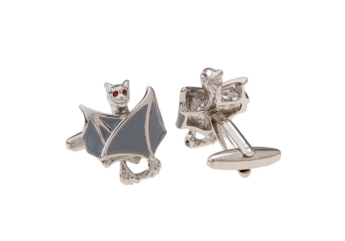 Pair of silver earrings with cat and diamond designs on a white background