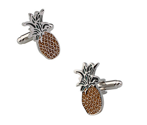 Pineapple-shaped cufflinks on a white background