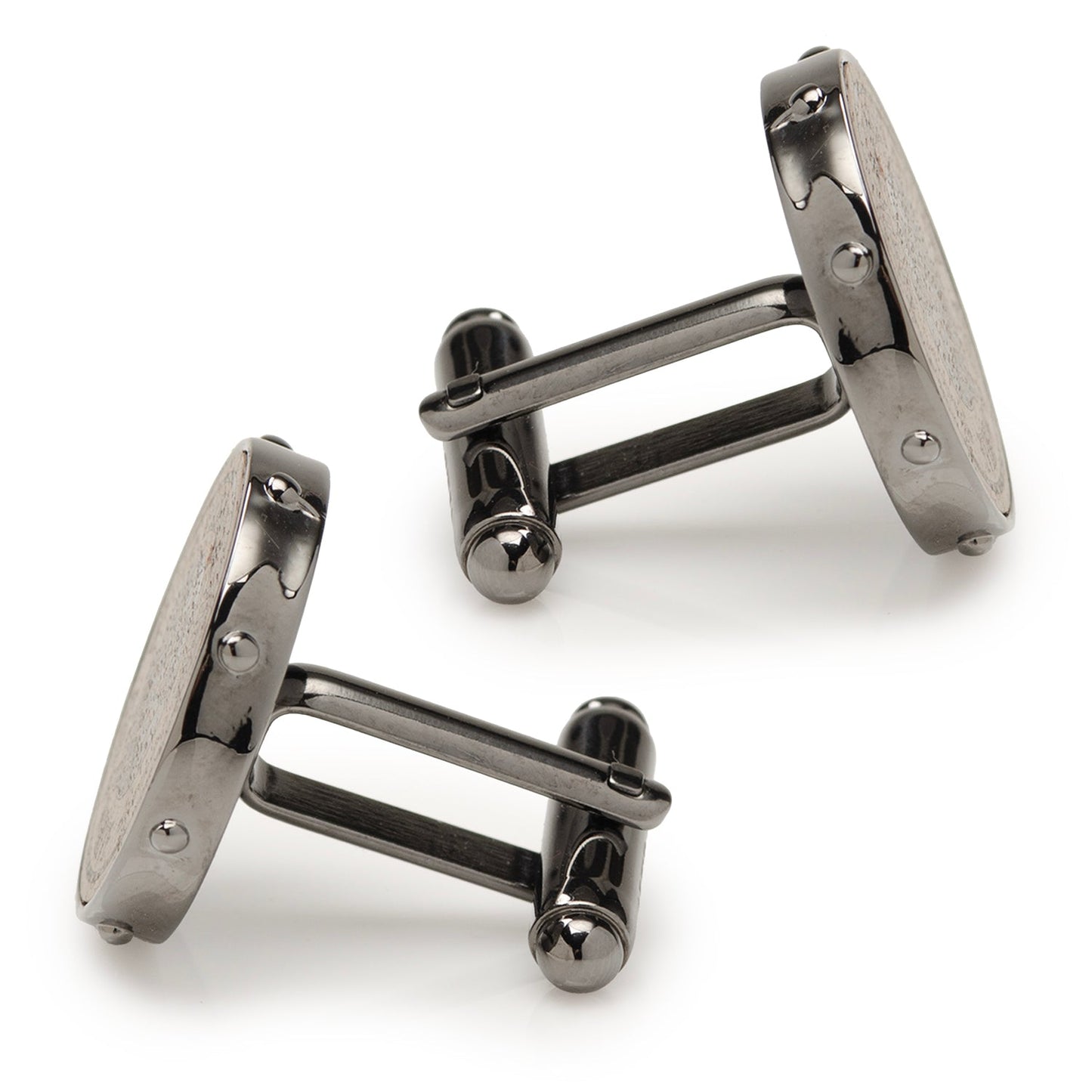 Pair of gunmetal cufflinks on a white background