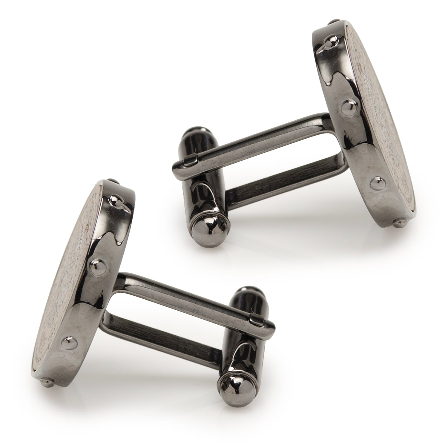 Pair of gunmetal cufflinks on a white background