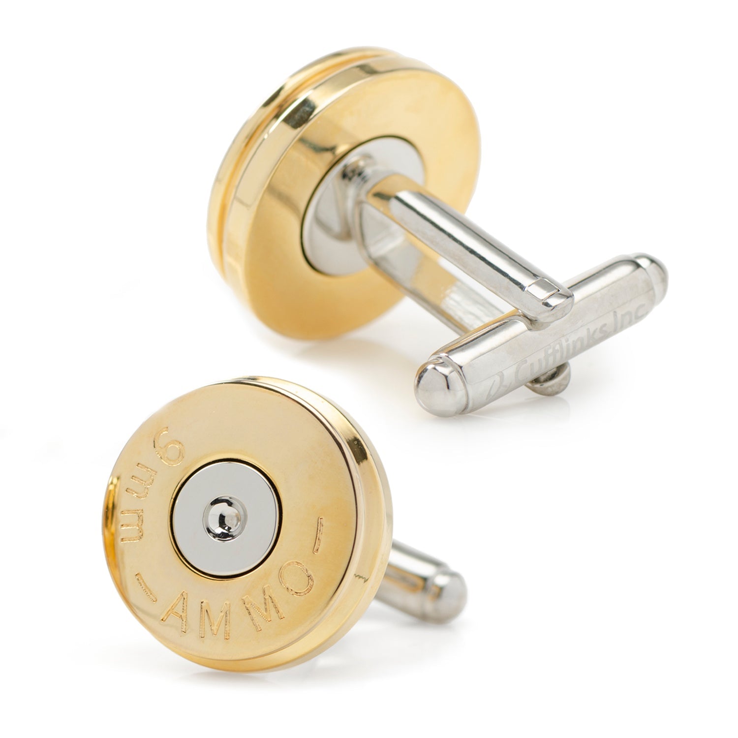 Gold and silver cufflinks on a white background