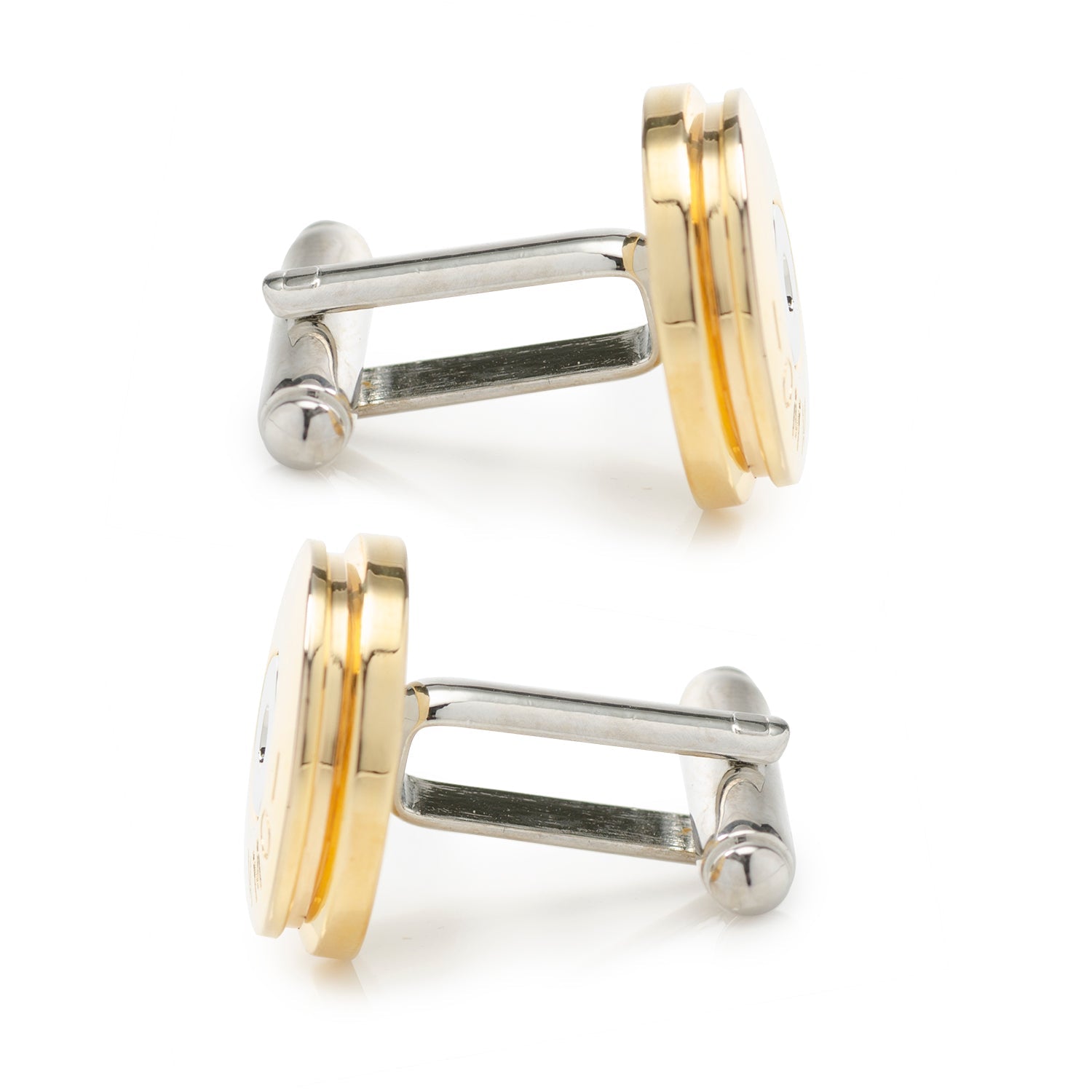Pair of gold and silver cufflinks on a white background