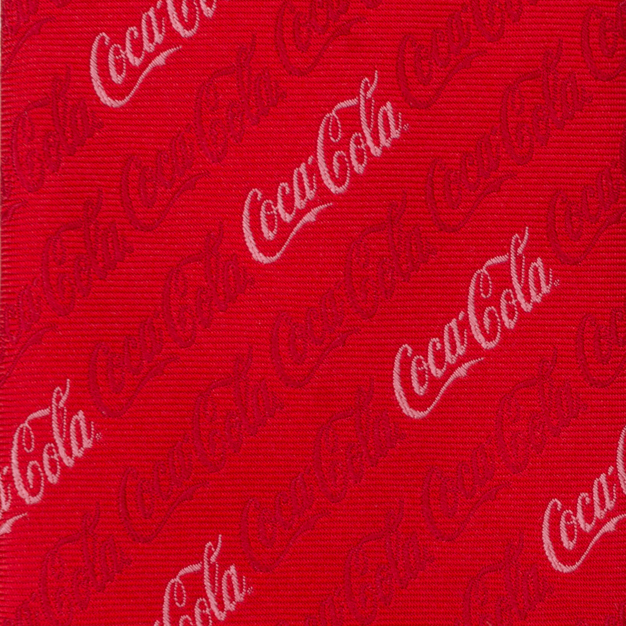 Red fabric with white Coca-Cola logo pattern