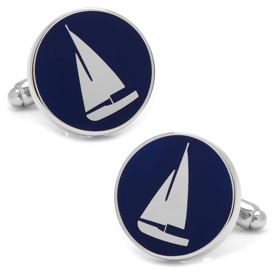 Sailboat cufflinks with navy blue and silver design on a white background