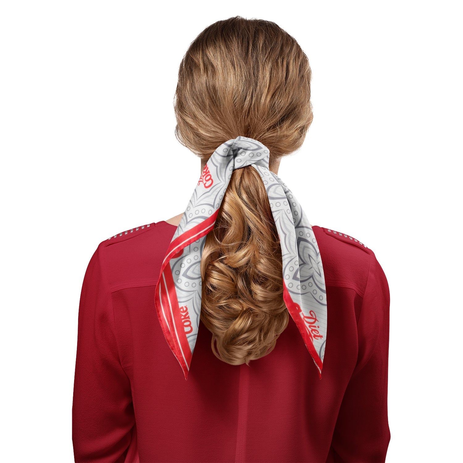 Person wearing a red shirt with a white and red patterned hair tie around their hair on a white background Diet Coke satin grey scarf with red logo border
