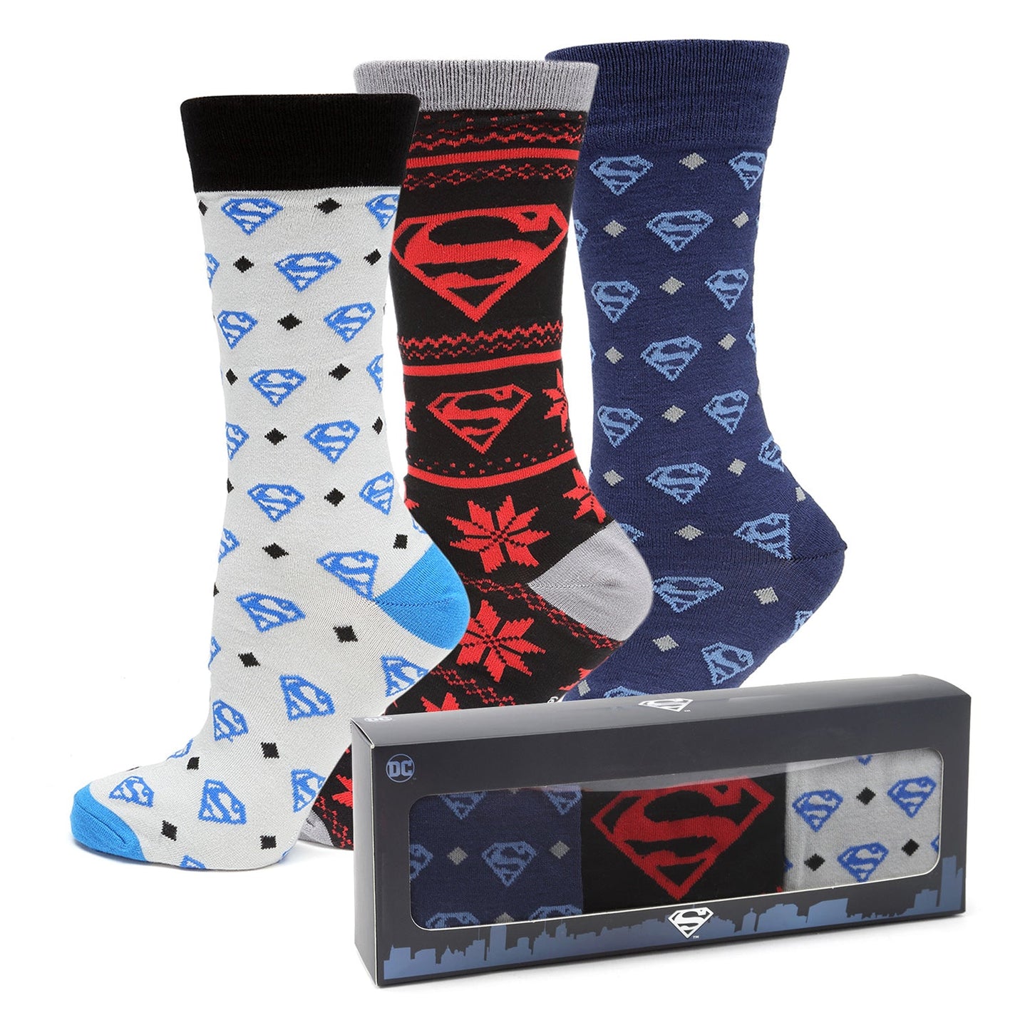 Three pairs of Superman-themed socks with a packaging box on a white background