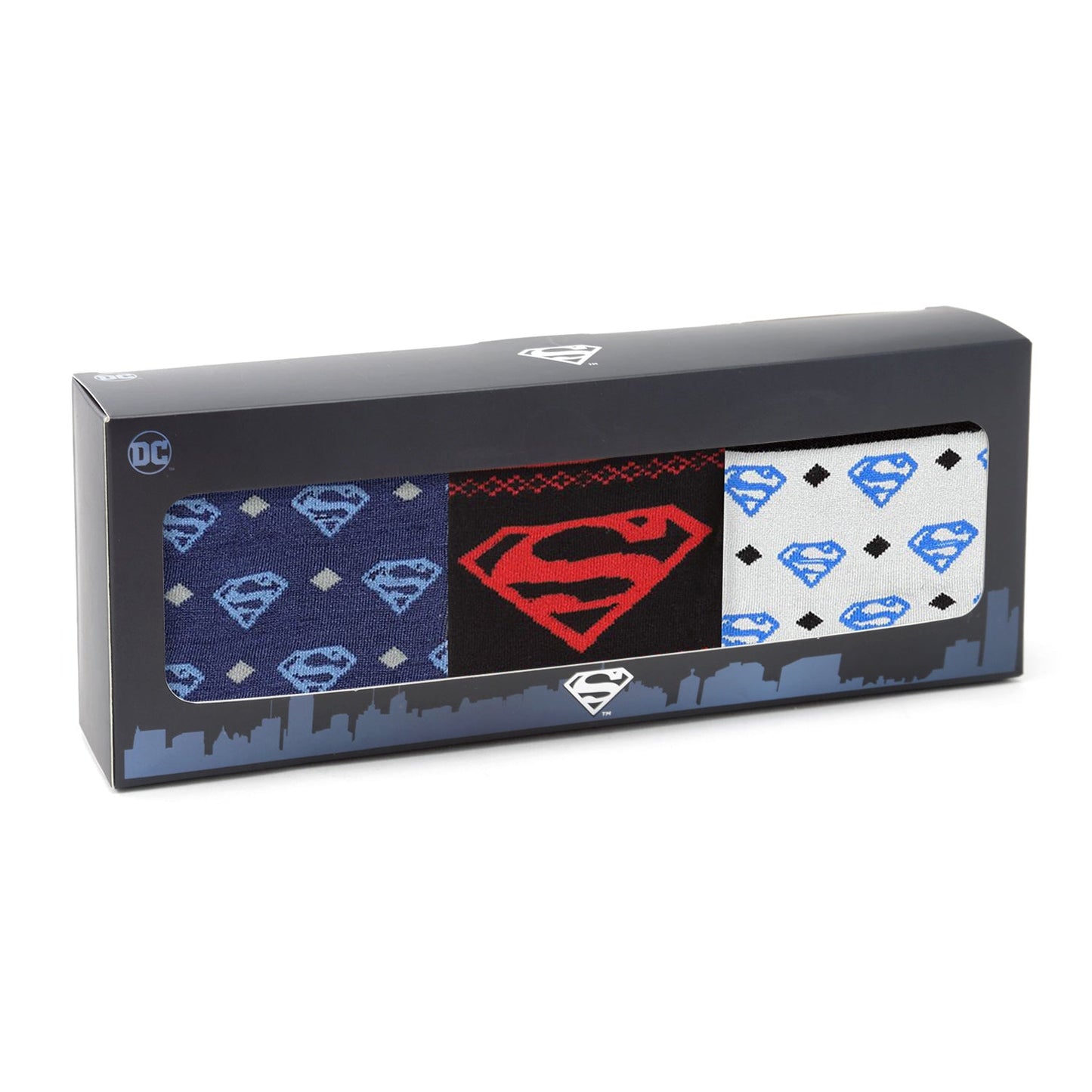 Box of Superman-themed socks with various patterns on a white background