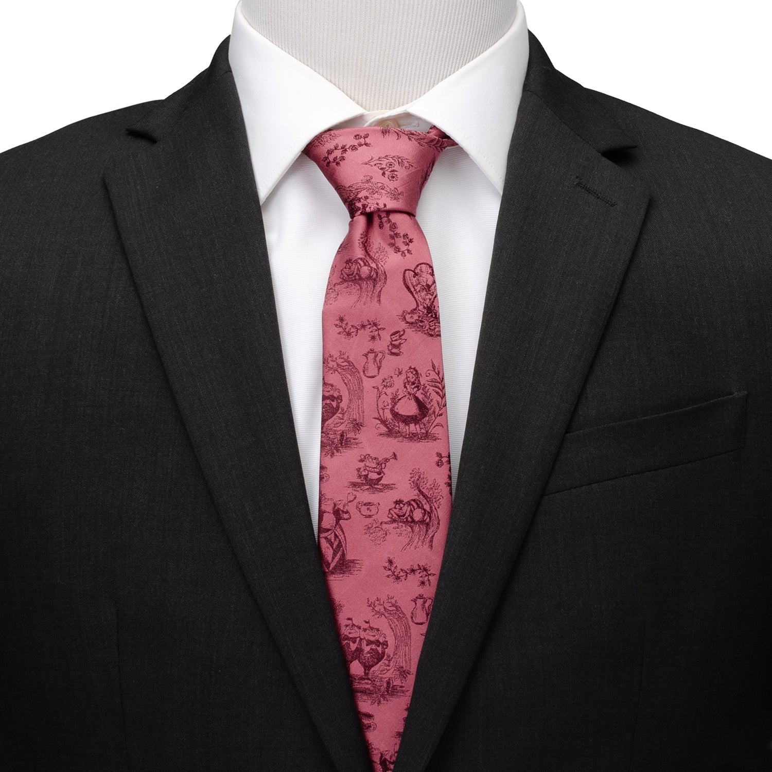Black suit with a white shirt and pink patterned tie on a mannequin. Alice in Wonderland