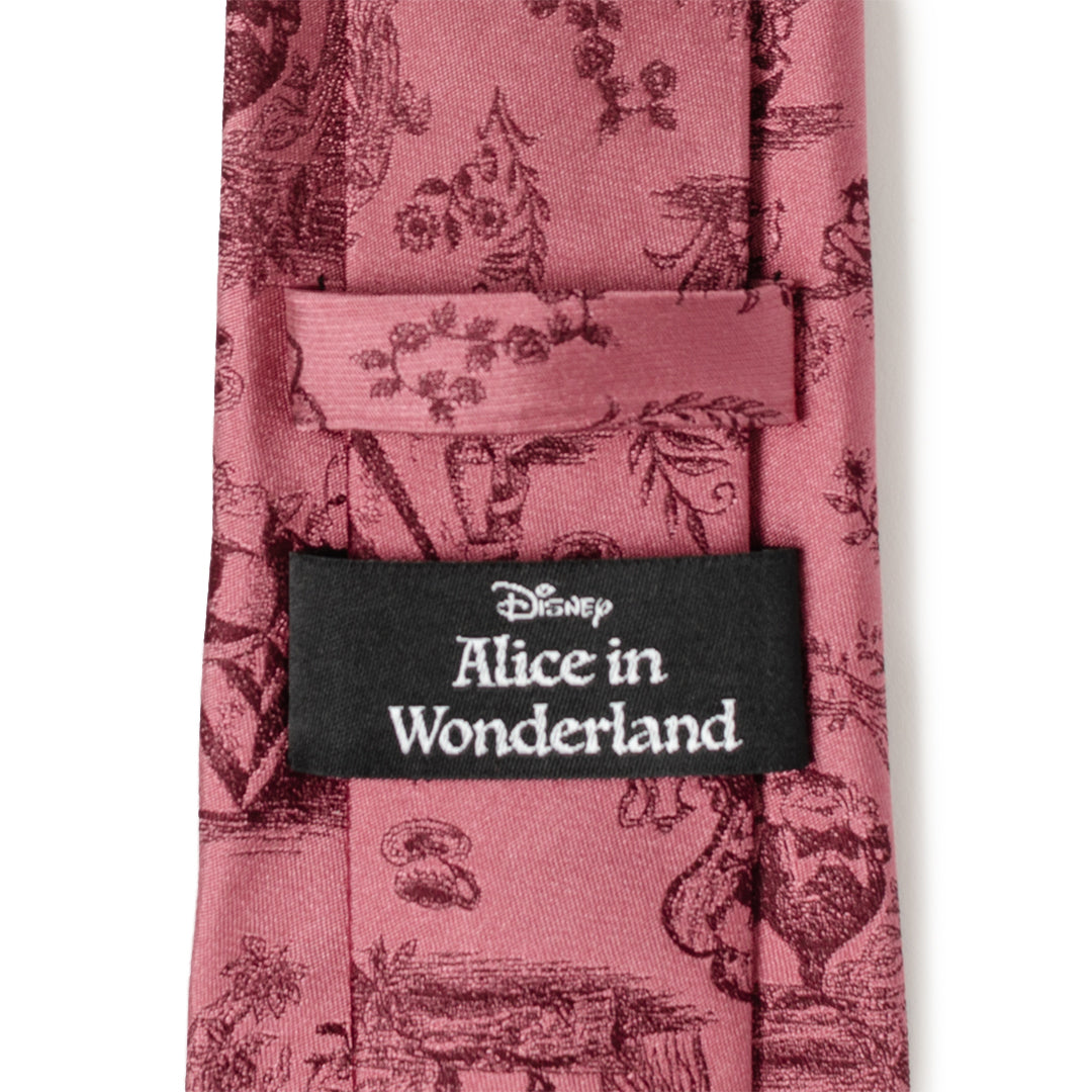 Pink tie with vintage-style design and Disney Alice in Wonderland label