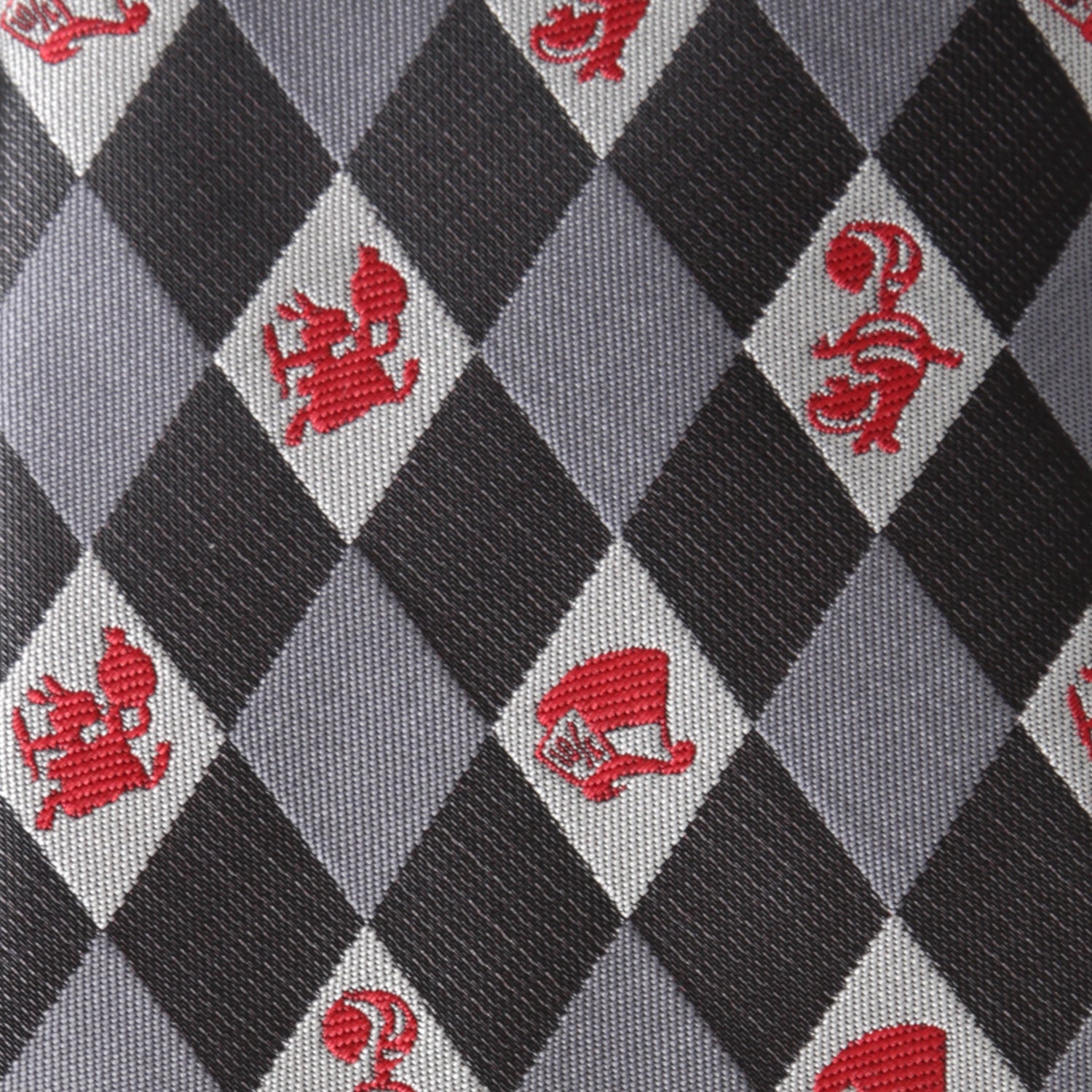 Patterned fabric with red symbols on a gray and black checkered background