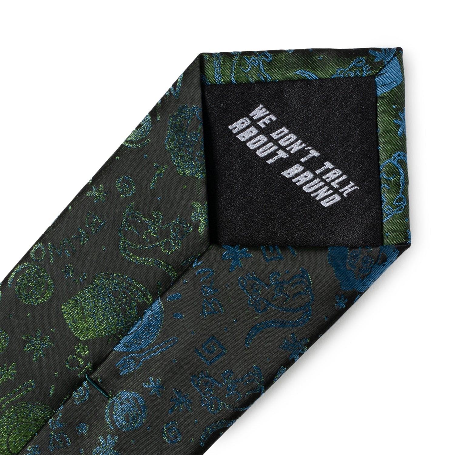Patterned tie with a black patch displaying 'WE DON'T TALK ABOUT BRUDDA' on a white background