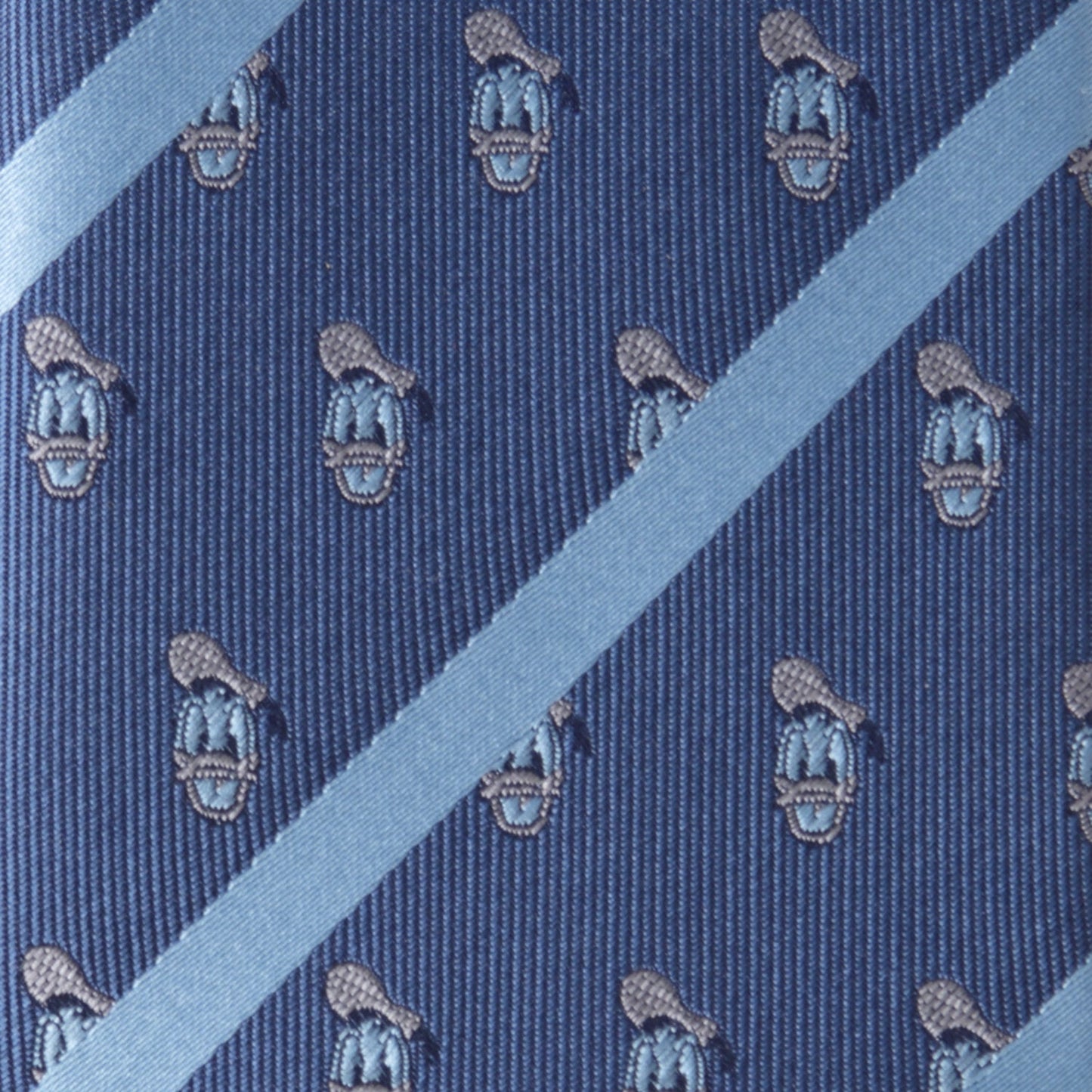 Blue tie with a pattern of lacrosse sticks and balls on a diagonal stripe background Donald Duck