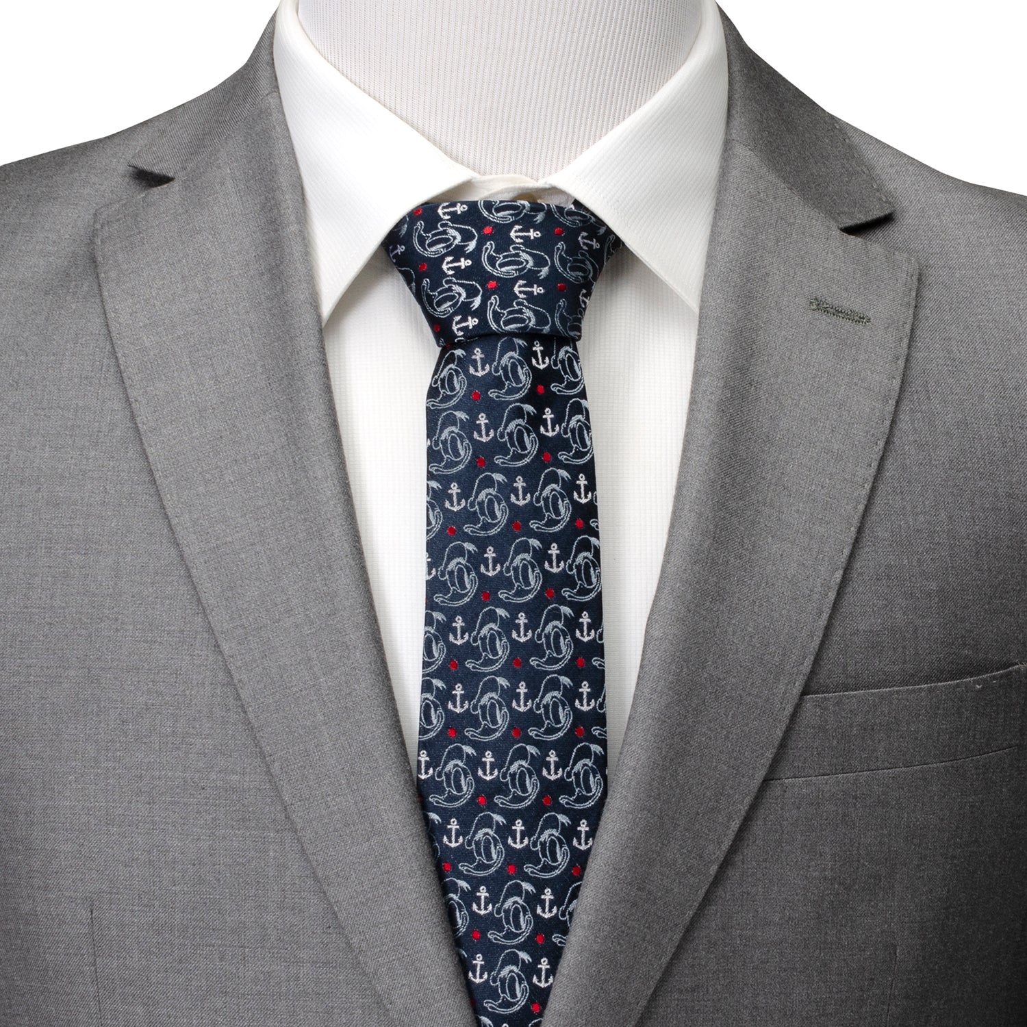 Gray suit with a white shirt and patterned tie on a plain background