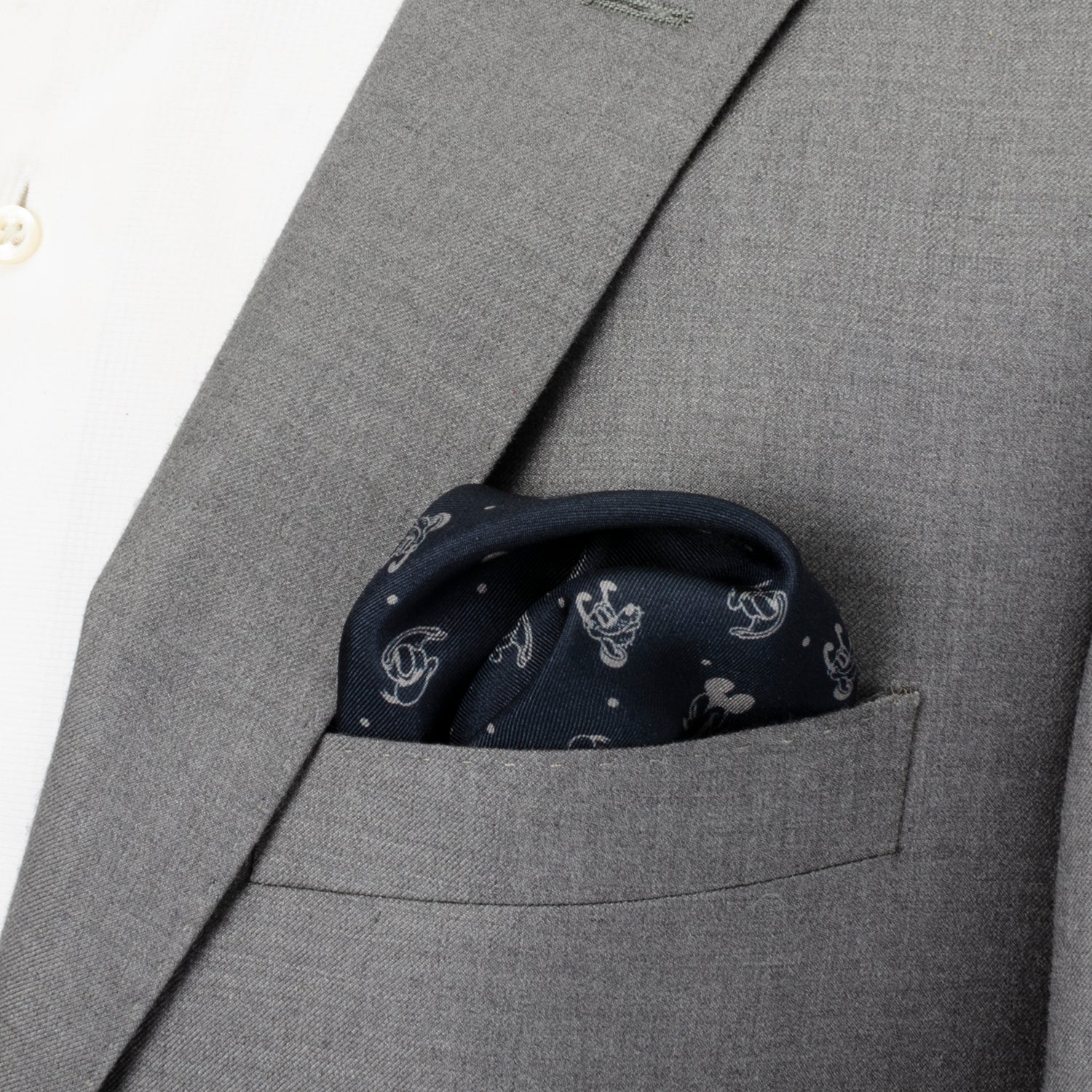 Disney Mickey and Friends Silk Pocket Square featuring navy background with white Mickey, Donald, and Pluto motifs and a burgundy border. Officially licensed by Disney.