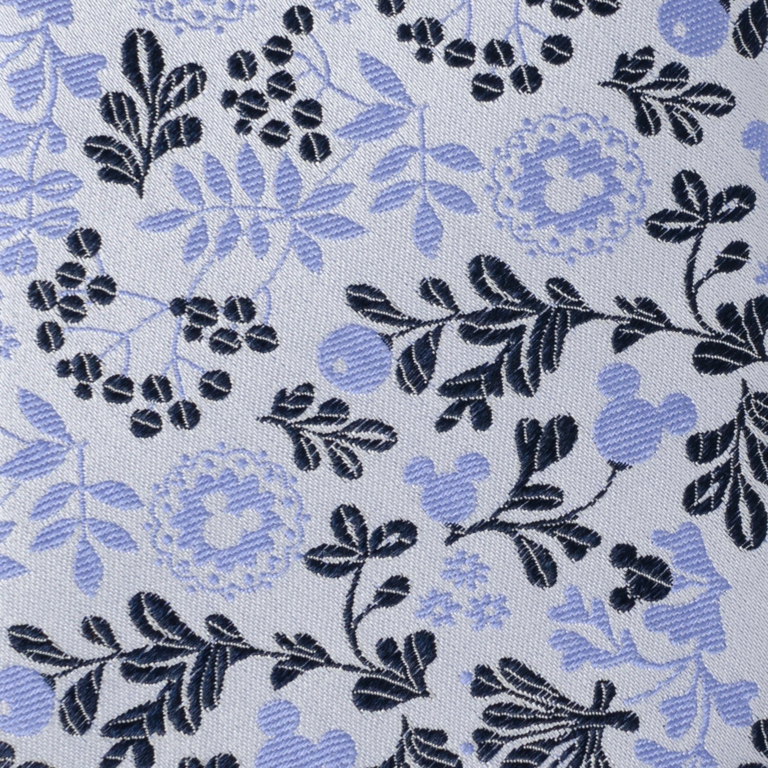 Floral pattern with blue and black design on a light gray background Hidden Mickey mouse