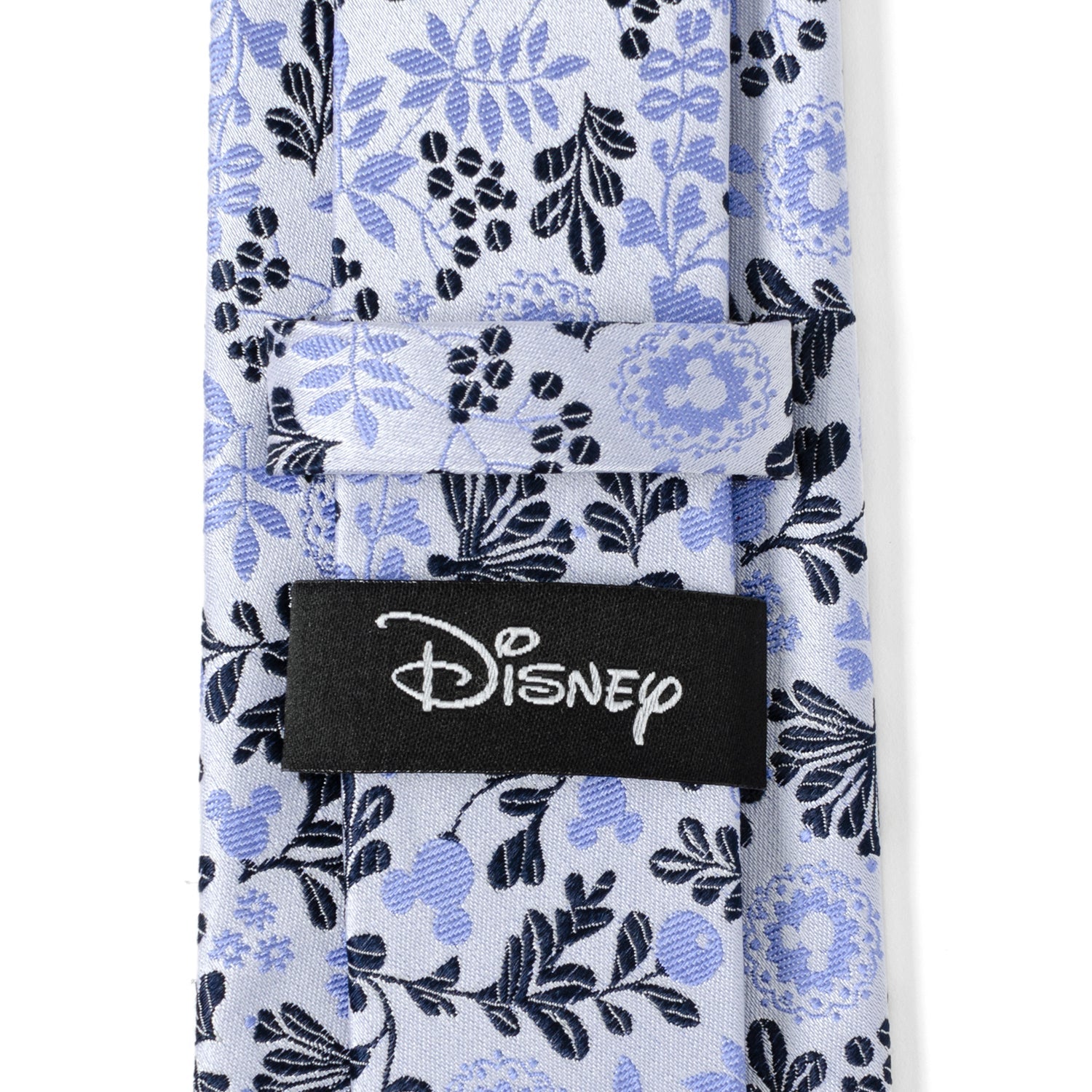 Floral patterned tie with a Disney logo tag on a white background