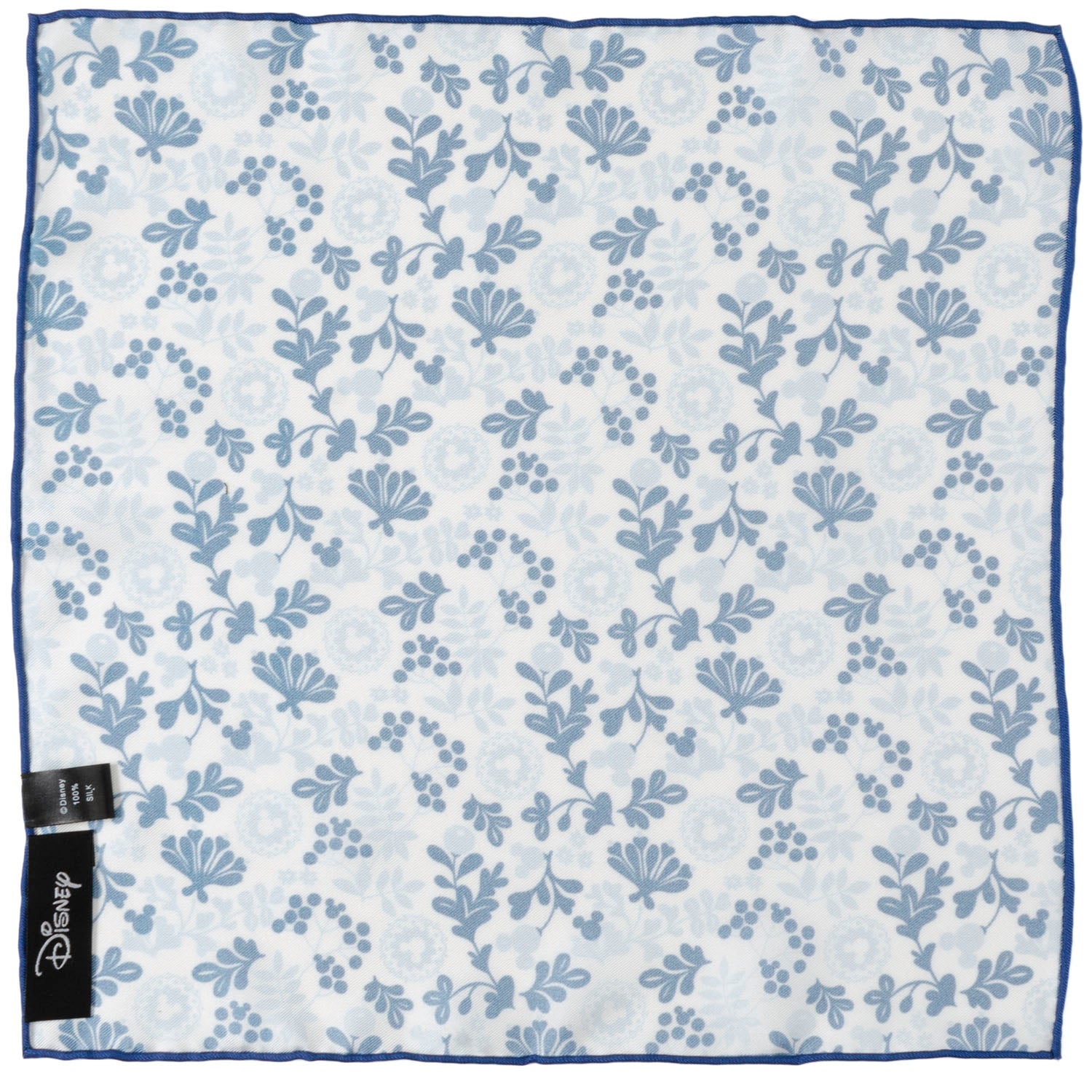 Floral patterned fabric with a tag on a light blue background Mickey Mouse