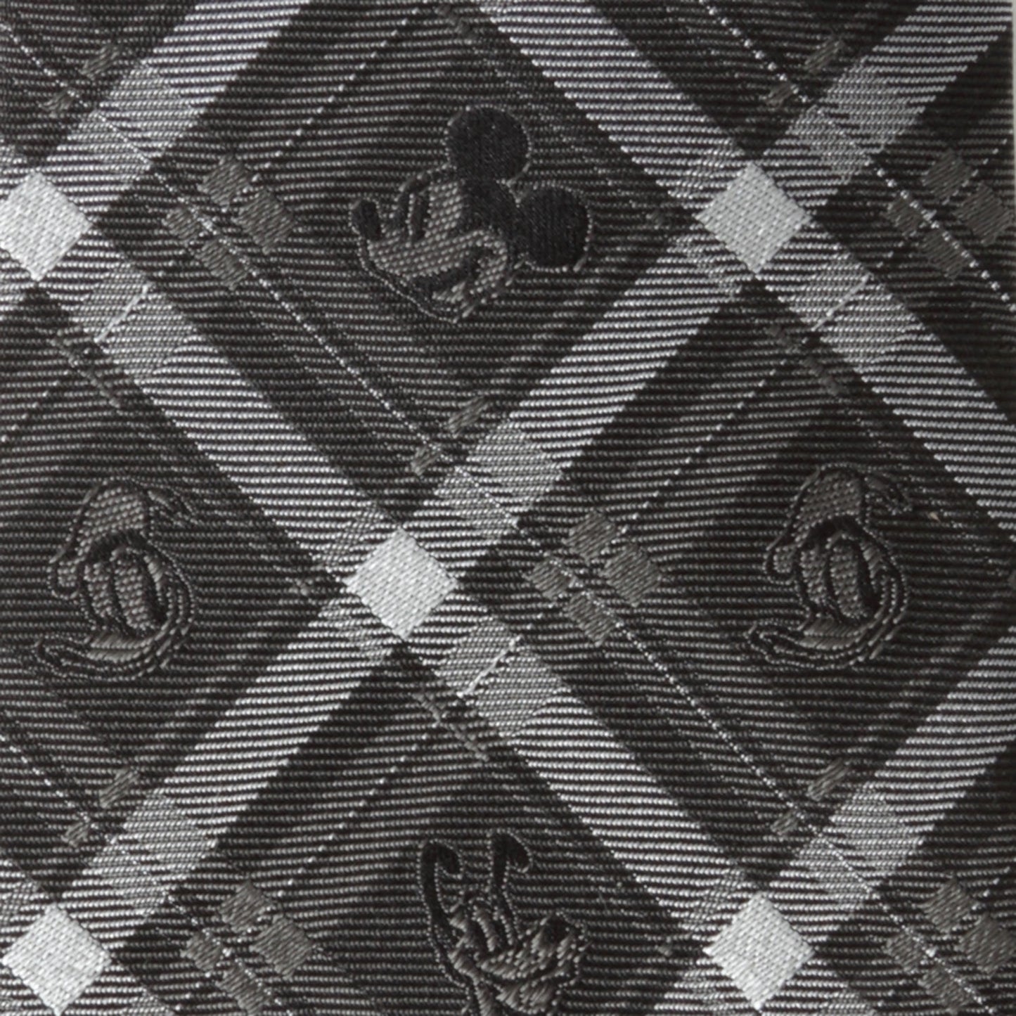 Close-up of a patterned fabric with geometric shapes and textures.