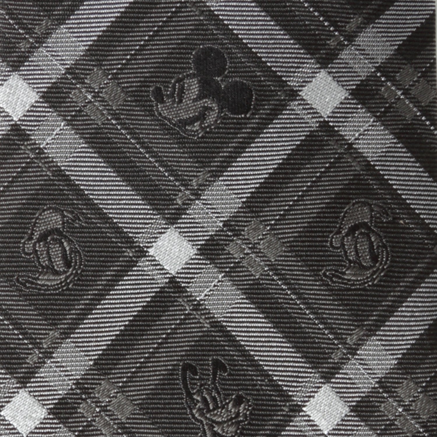 Close-up of a patterned fabric with geometric shapes and textures.