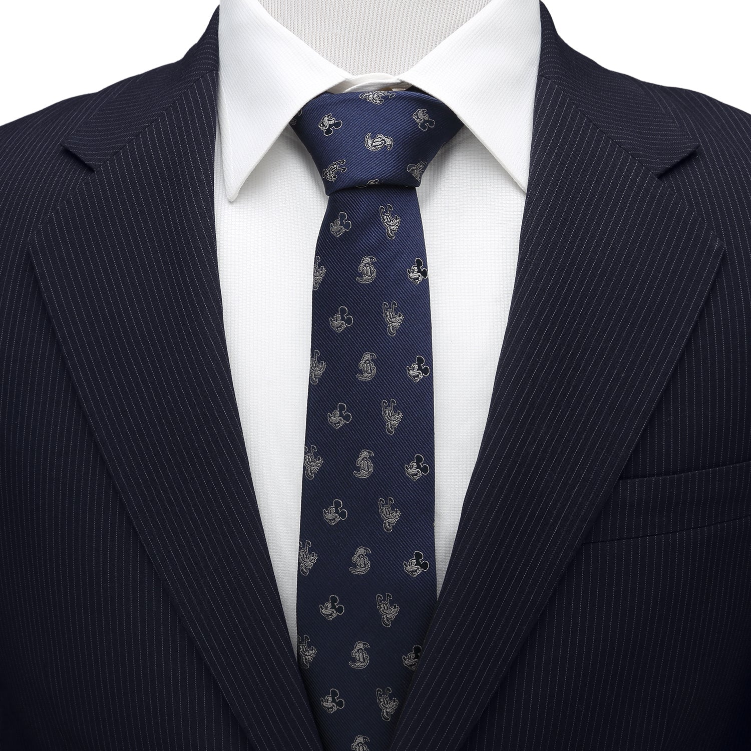 Navy pinstripe suit with a white shirt and blue patterned tie on a white background