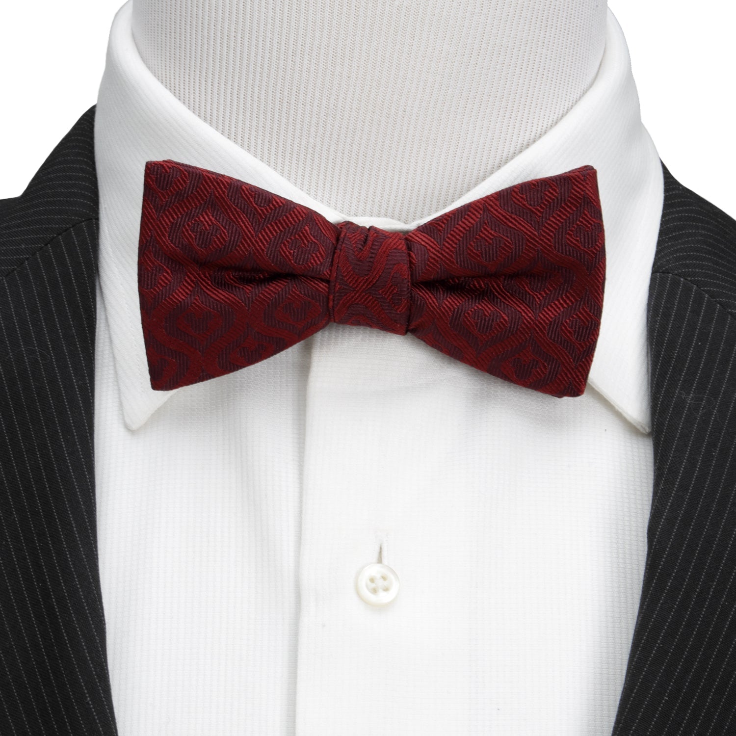 Red bow tie on a mannequin with a black suit and white shirt Hidden Mickey mouse