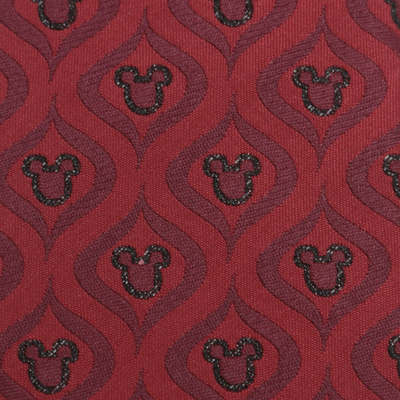 Red fabric with black Mickey Mouse head pattern