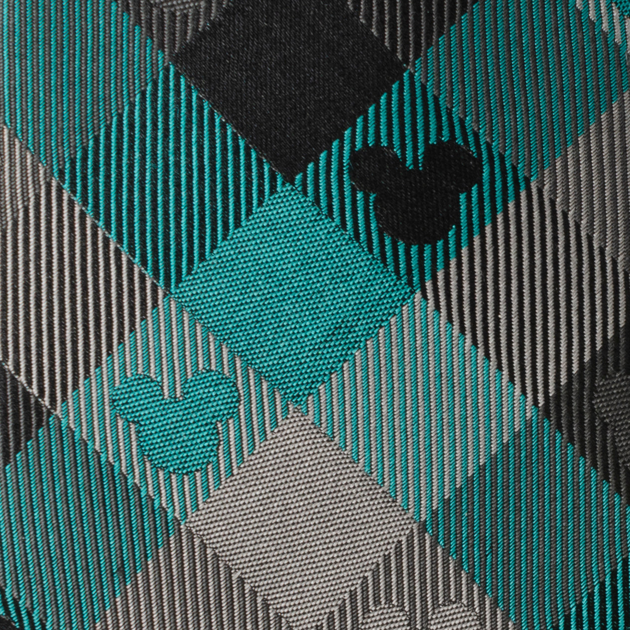 Disney Mickey Mouse teal plaid silk men’s tie featuring woven Mickey silhouette pattern. Officially licensed by Disney.