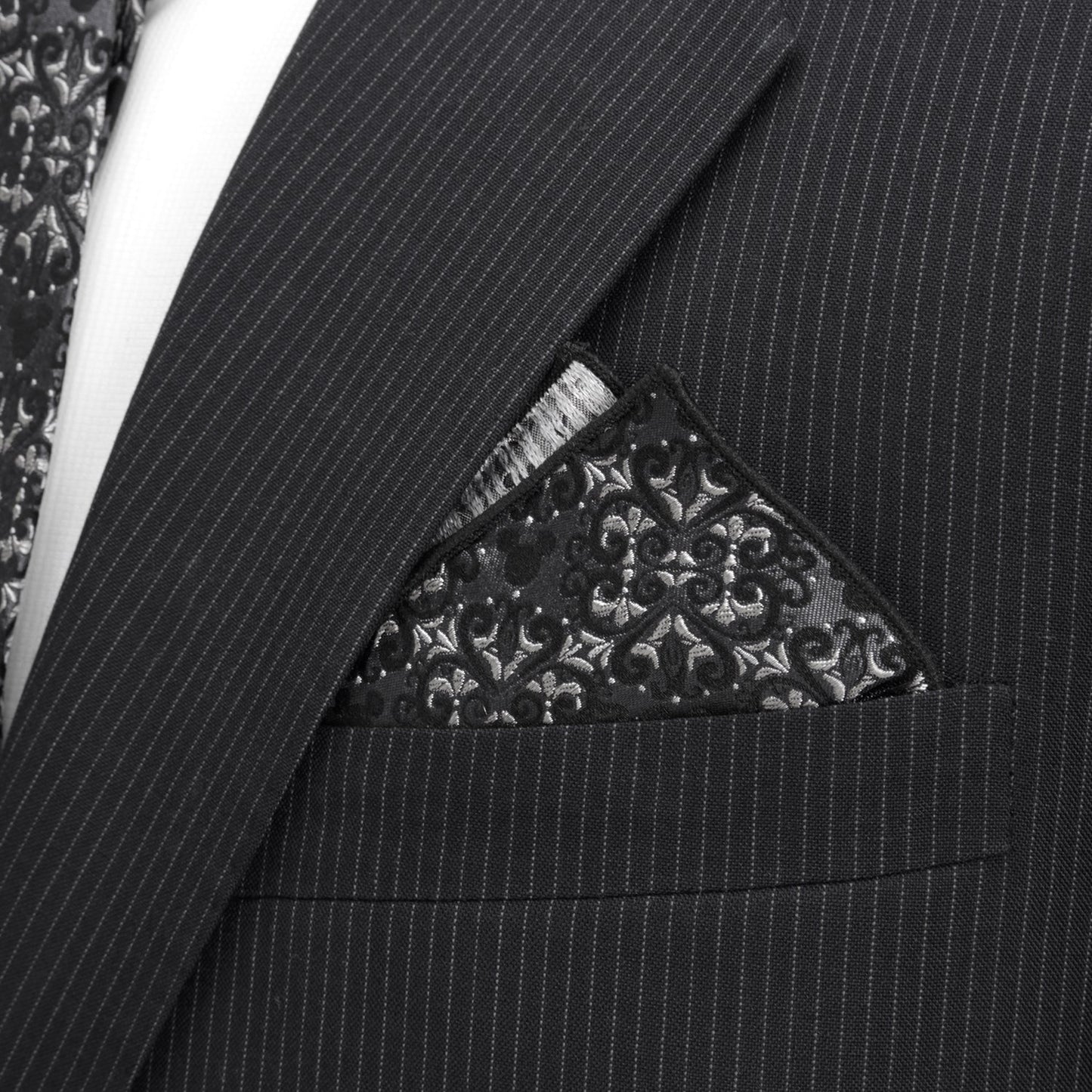 Black pinstripe suit with a patterned pocket square Hidden Mickey house