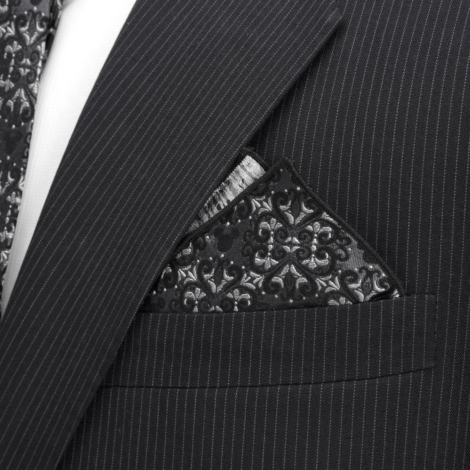 Black pinstripe suit with a patterned pocket square Hidden Mickey house