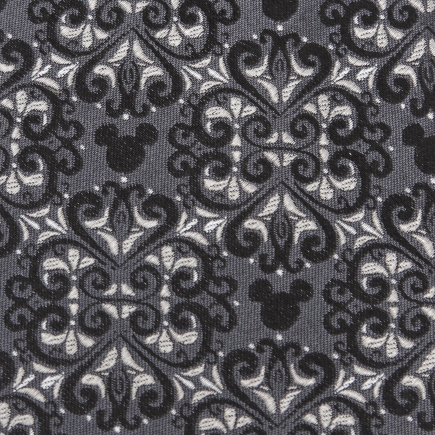 Decorative fabric with black and white pattern and Mickey Mouse head design.