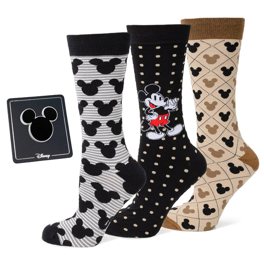 Four pairs of Disney-themed socks with different patterns on a white background.