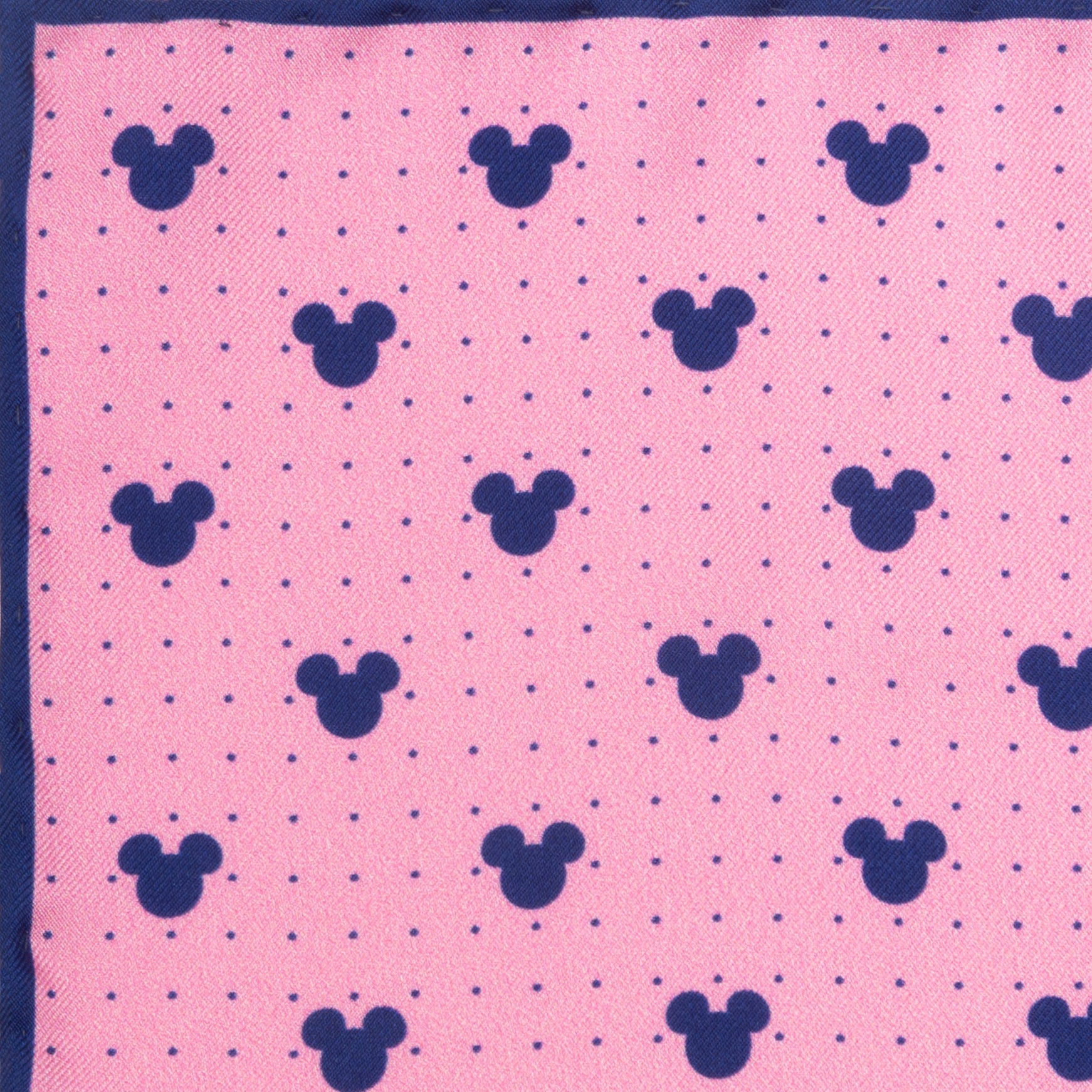 Pink fabric with blue mickey mouse heads pattern