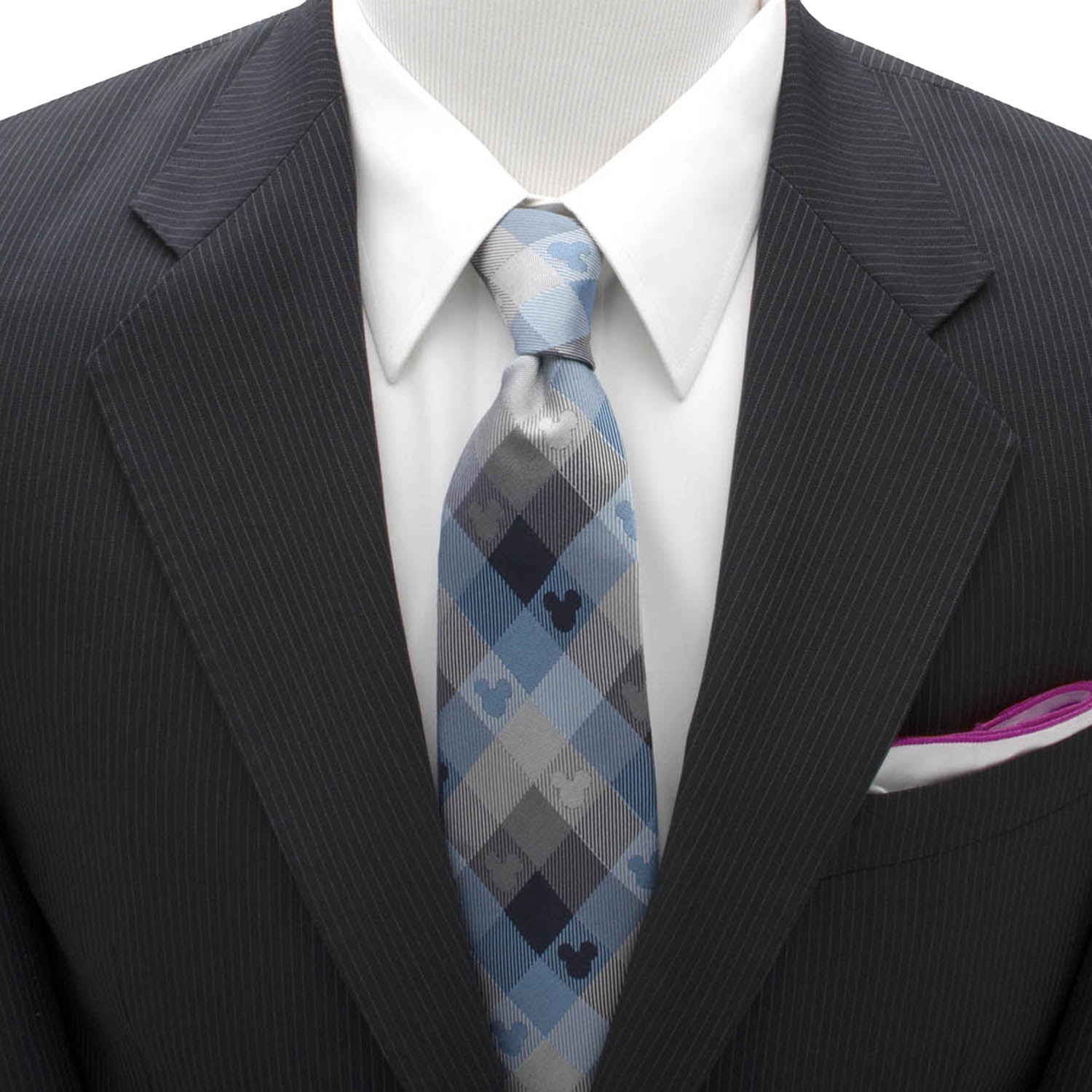 Black suit with a white shirt and blue plaid tie on a mannequin. Mickey Mouse