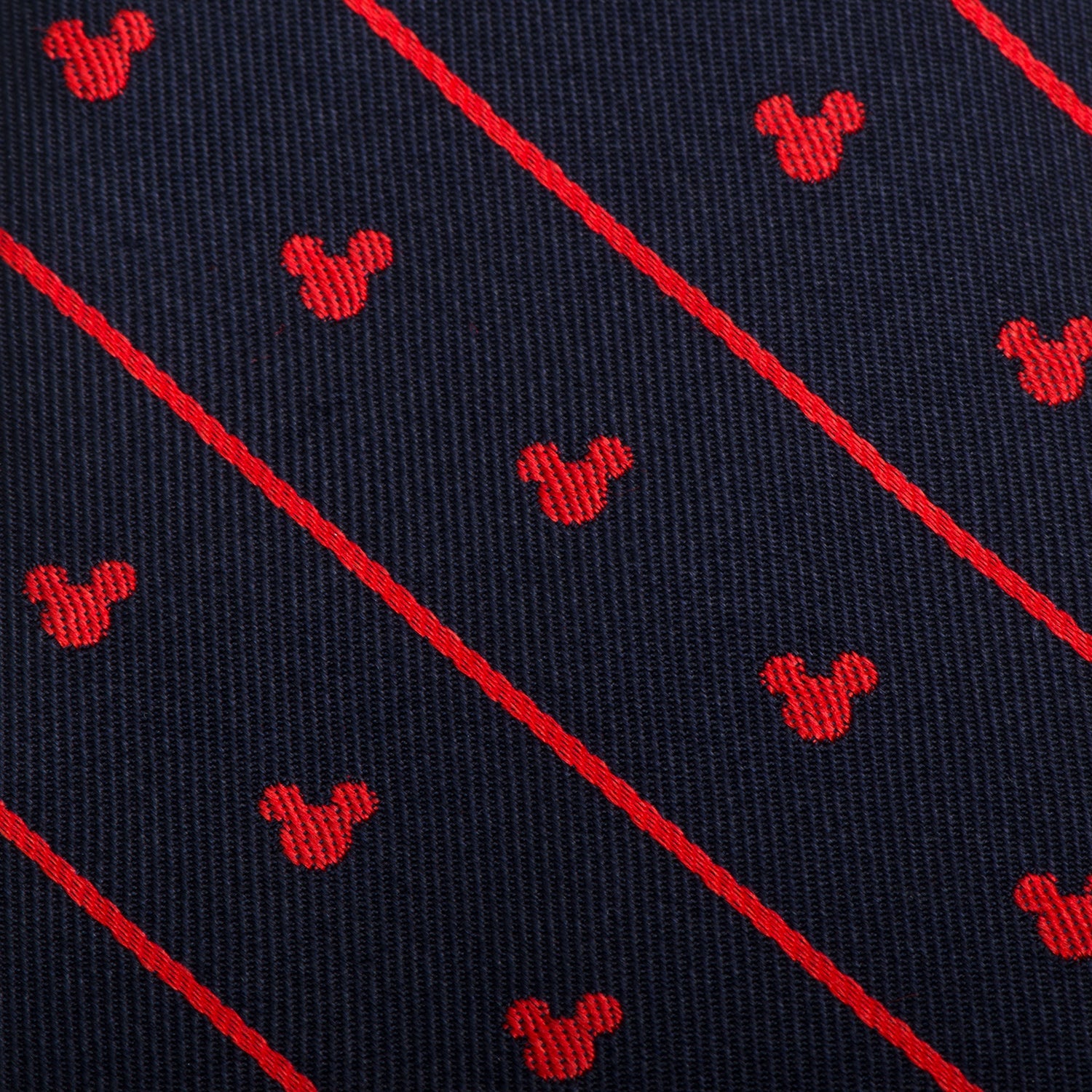 Navy blue tie with red diagonal stripes and small red Mickey Mouse heads pattern