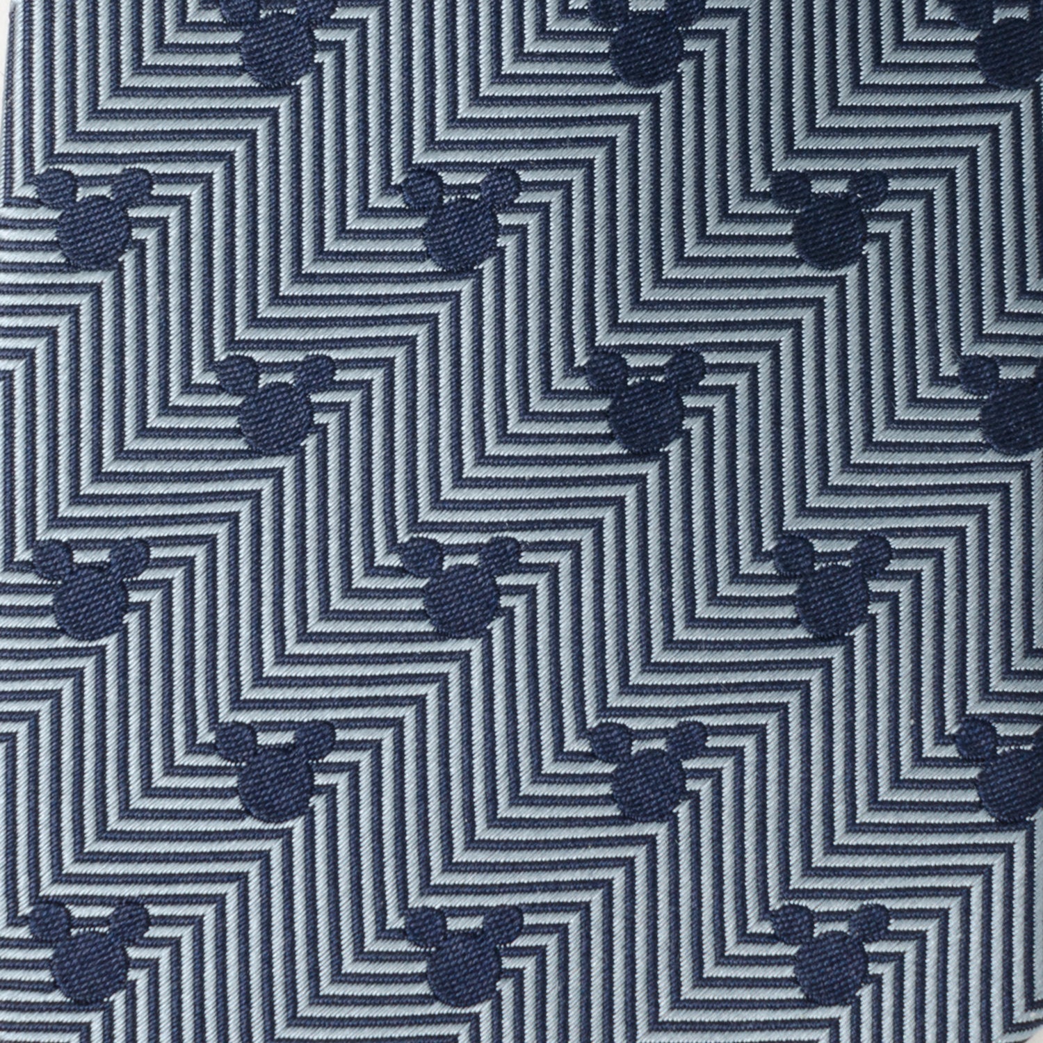Patterned fabric with zigzag design and small mouse head icons on a blue background Mickey mouse