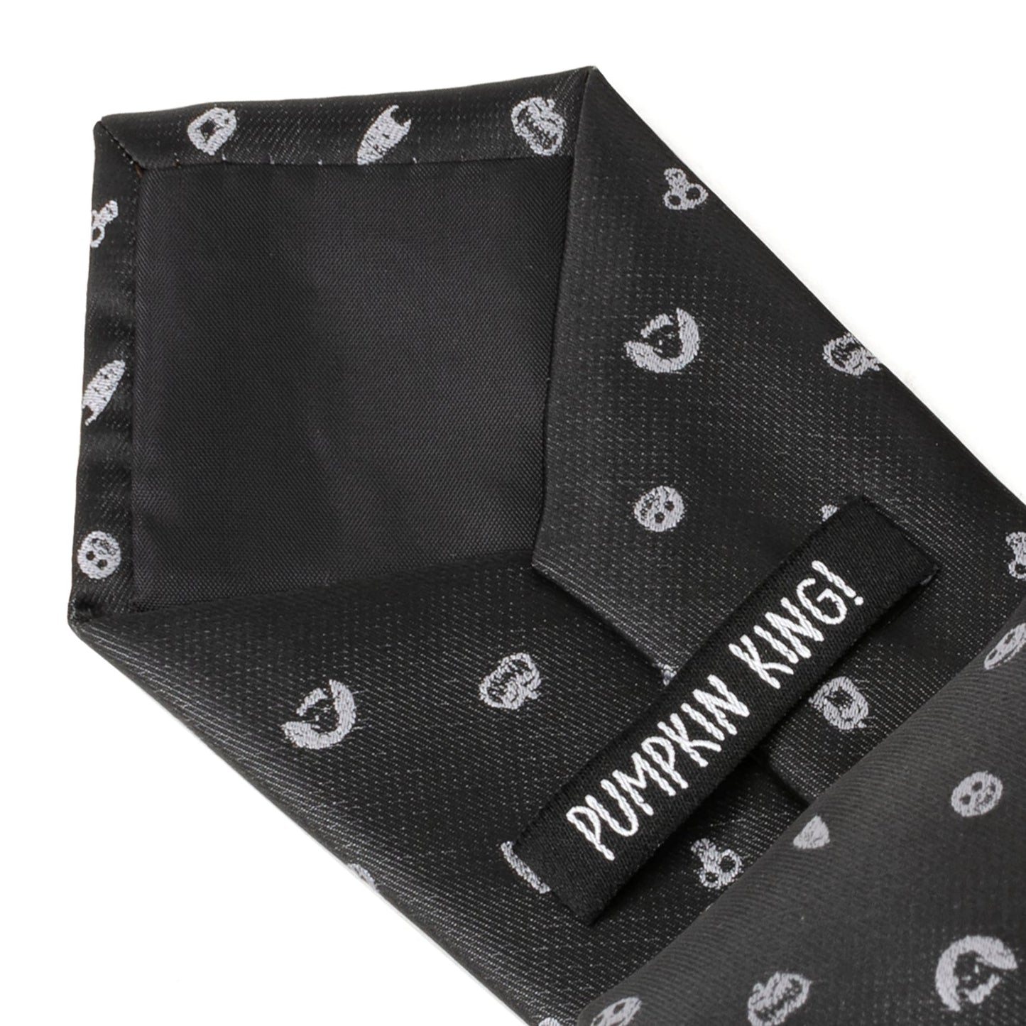 Black tie with white skull patterns and a label reading 'Pumpkin Kwai' on a white background